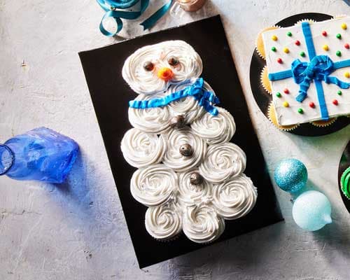 Snowman Pull-Apart Cake with blue and white icing shaped like a snowman