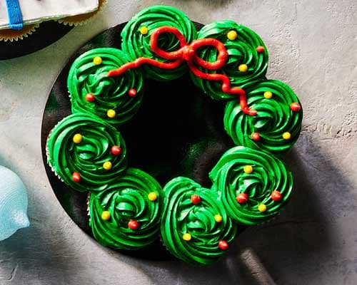 Wreath Pull-Apart Cake decorated with green icing and holiday toppings